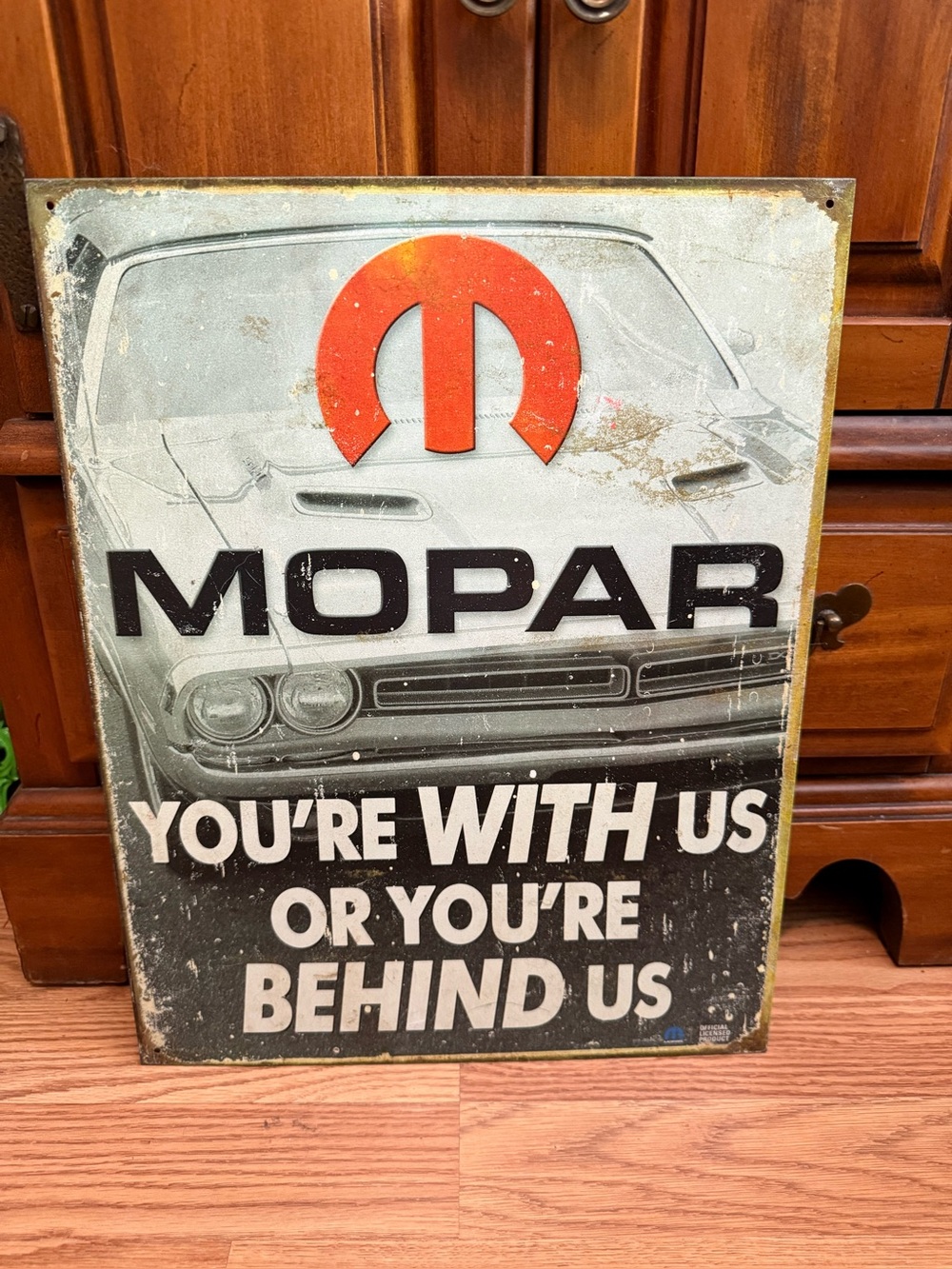licensed Mopar metal sign featuring the slogan "You're With Us Or You're Behind